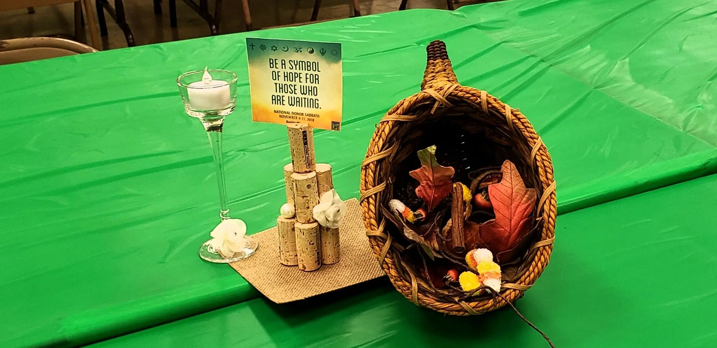Table centerpiece with autumn leaves and candle