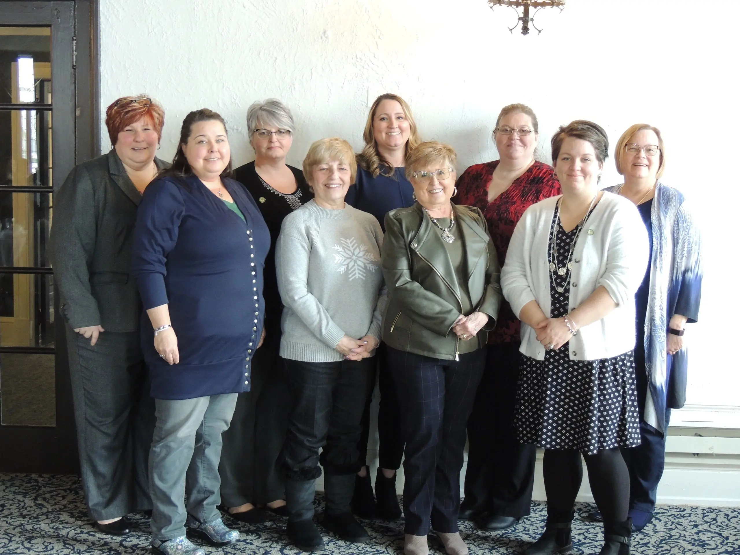 Women standing together smiling