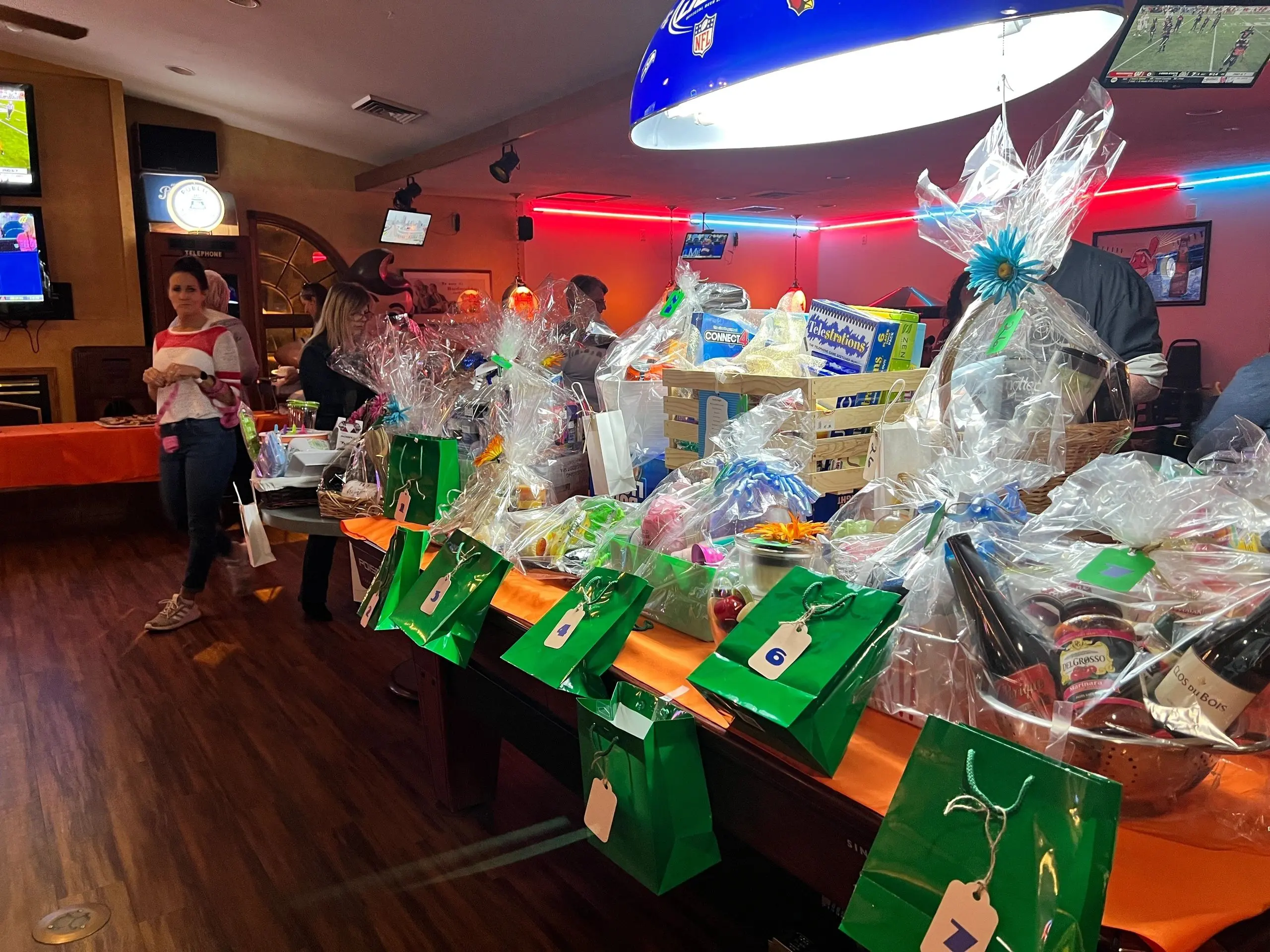 People browsing gift items on table