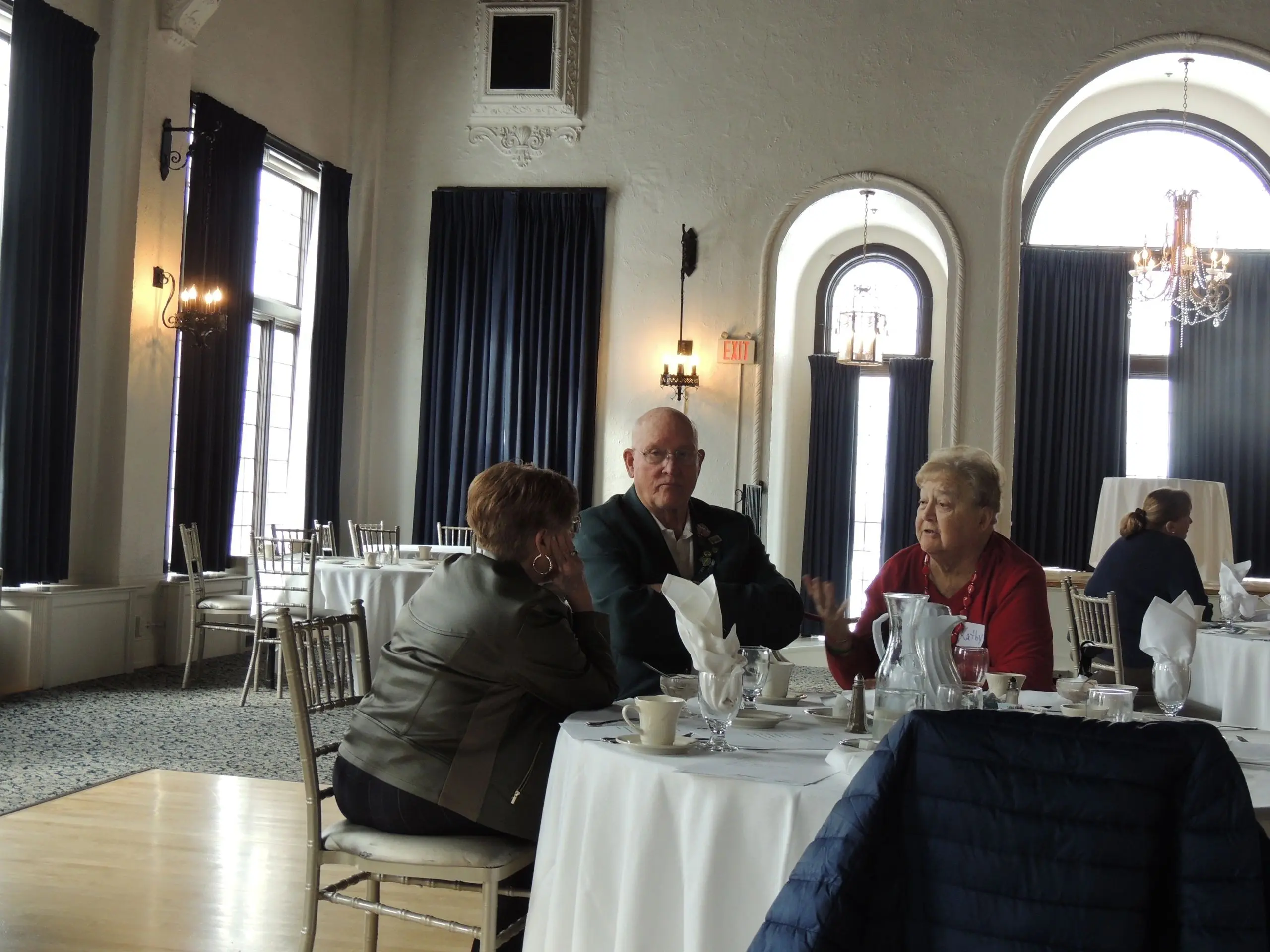 People conversing at a round table