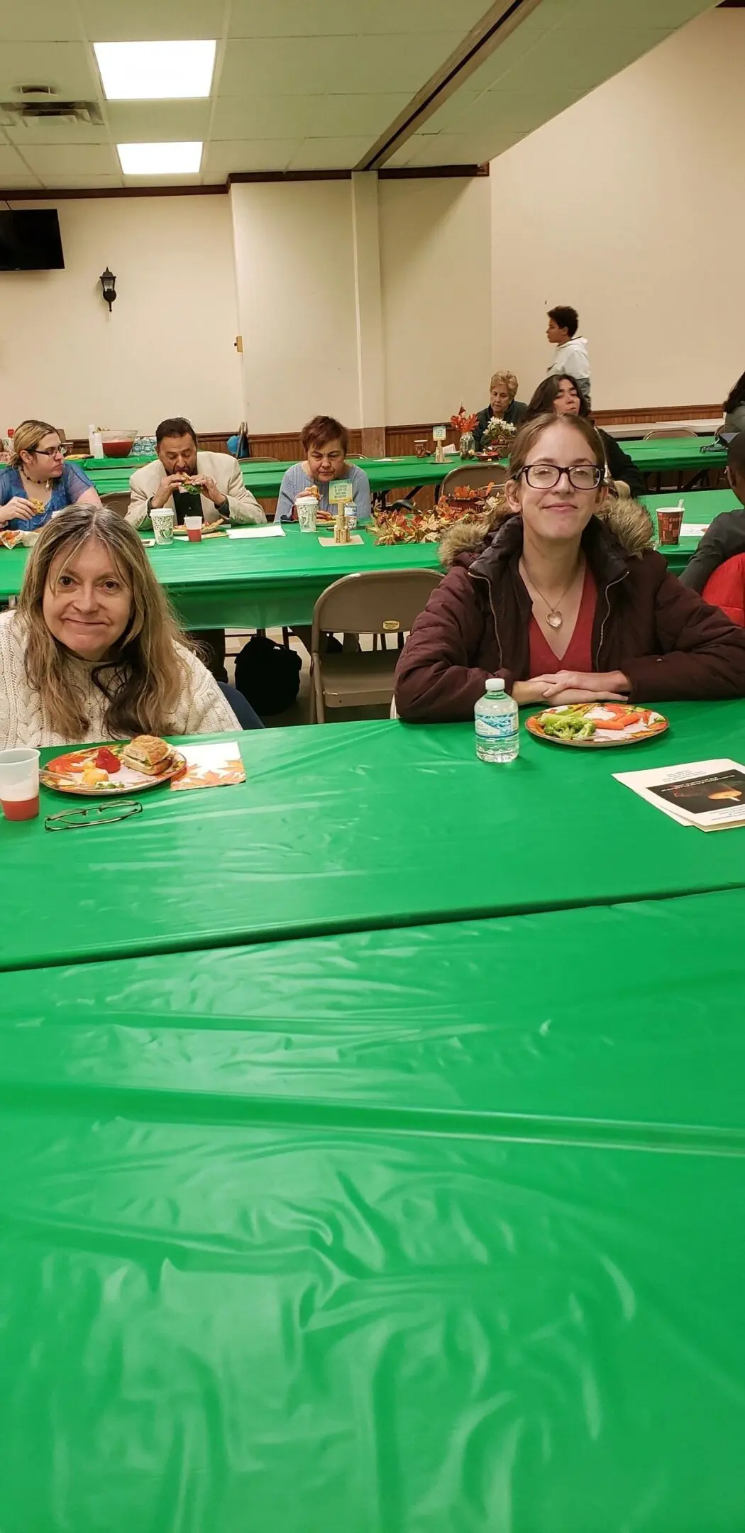 People enjoying a meal at community event.