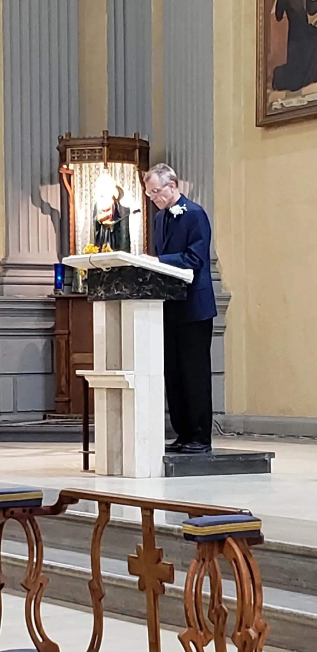 Church interior with man reading