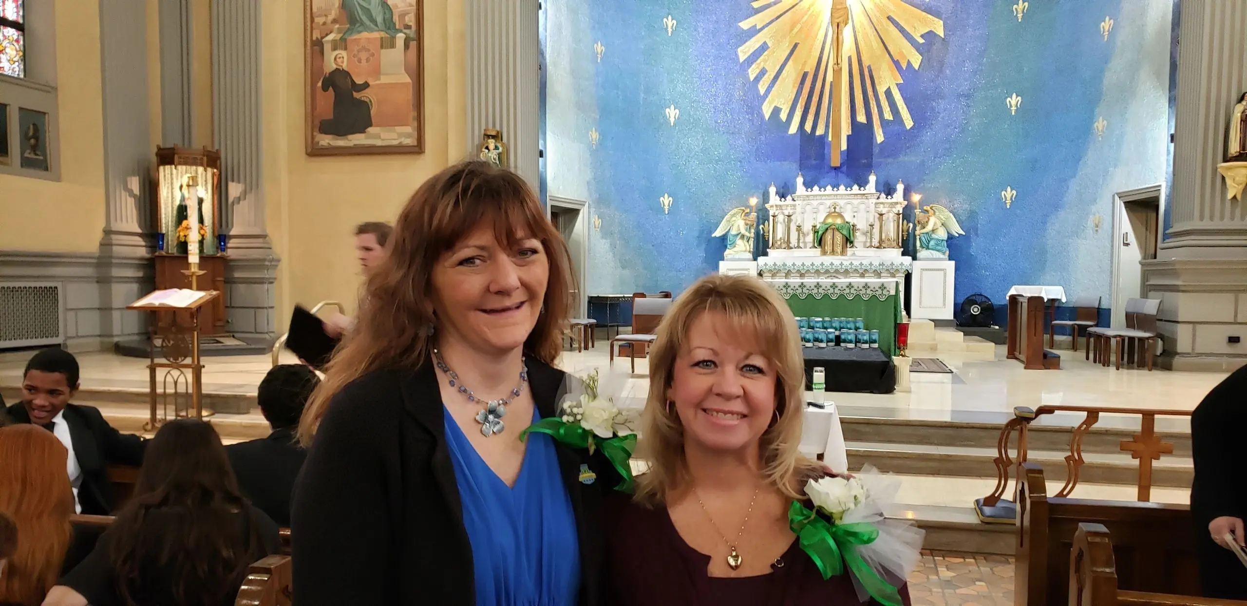 Friends posing in front of an altar