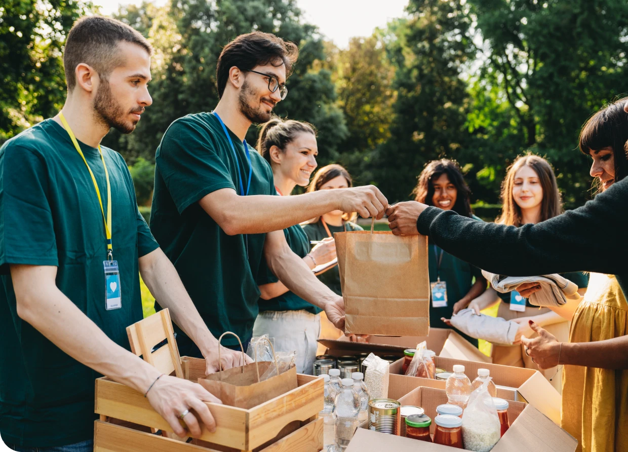 Volunteers distributing food at outdoor event